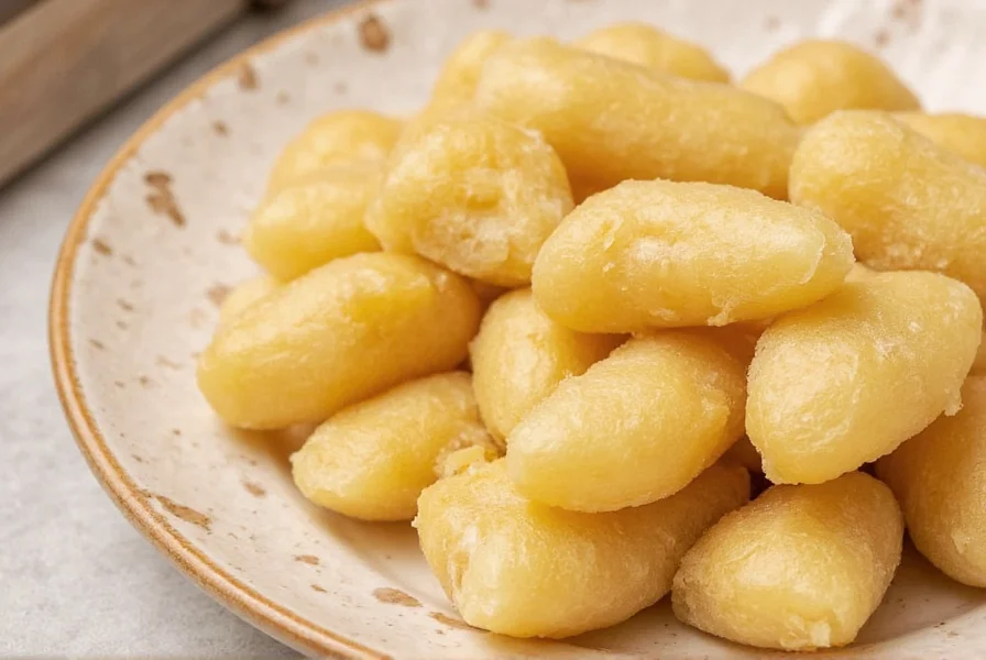Step-by-step process of making homemade crystallized ginger showing peeled ginger slices simmering in golden syrup with sugar crystals forming on the surface