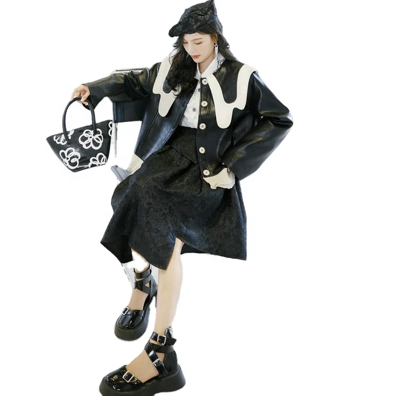 

2021 New Temperament Contrast Color Irregular Collar Single Breasted Top Loose Long Sleeve Leather Jacket With Ruffled Hem.