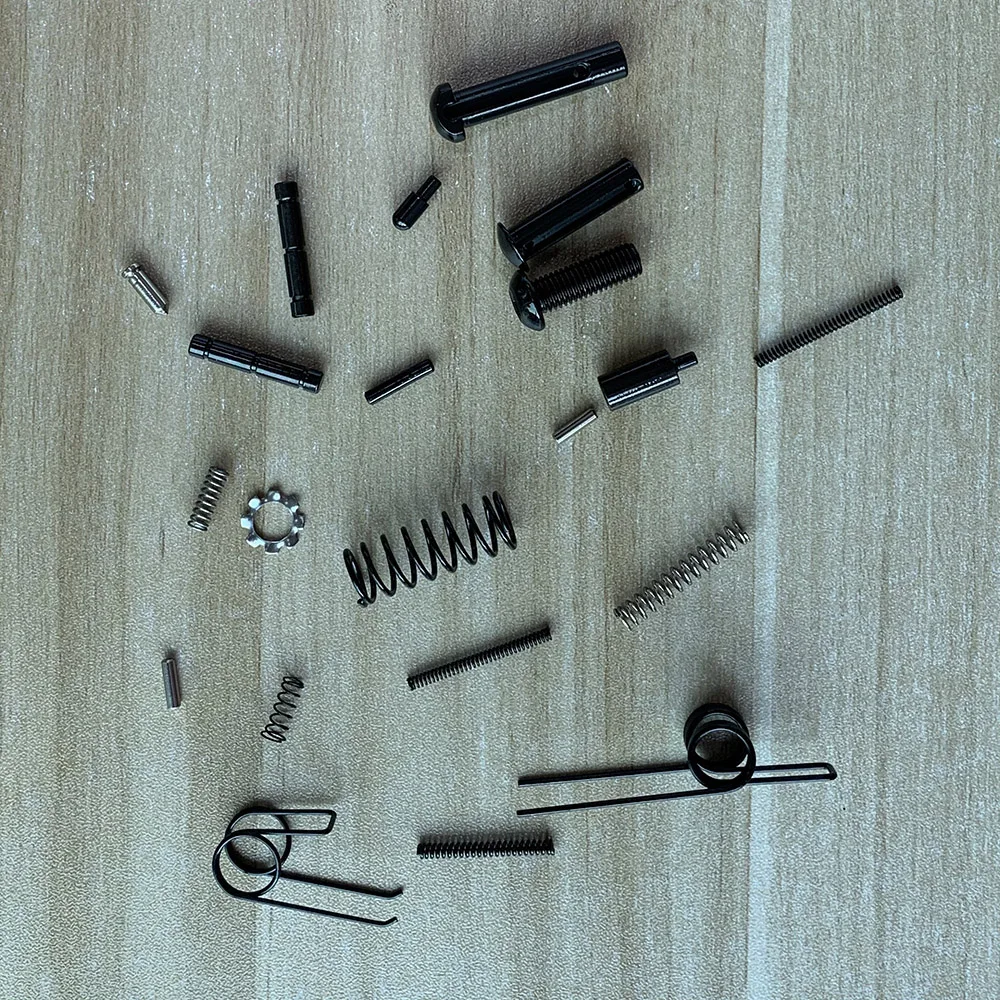 21件战术ar15整体较低销弹簧棘爪.223 5.56杂志抓住步枪狩猎配件