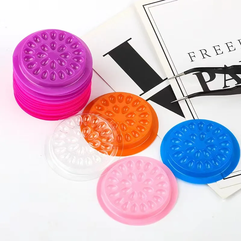

Wholesale New Flower Shape Light Weight Plastic Disposable Eyelash Glue Holder PVC Adhesive Holder Tray Pallet