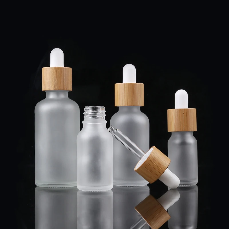 

1oz 30ml Hot Sale Glass Essential Oil Packaging Bottle Frosted Glass Bamboo Dropper Bottle With Bamboo Lid
