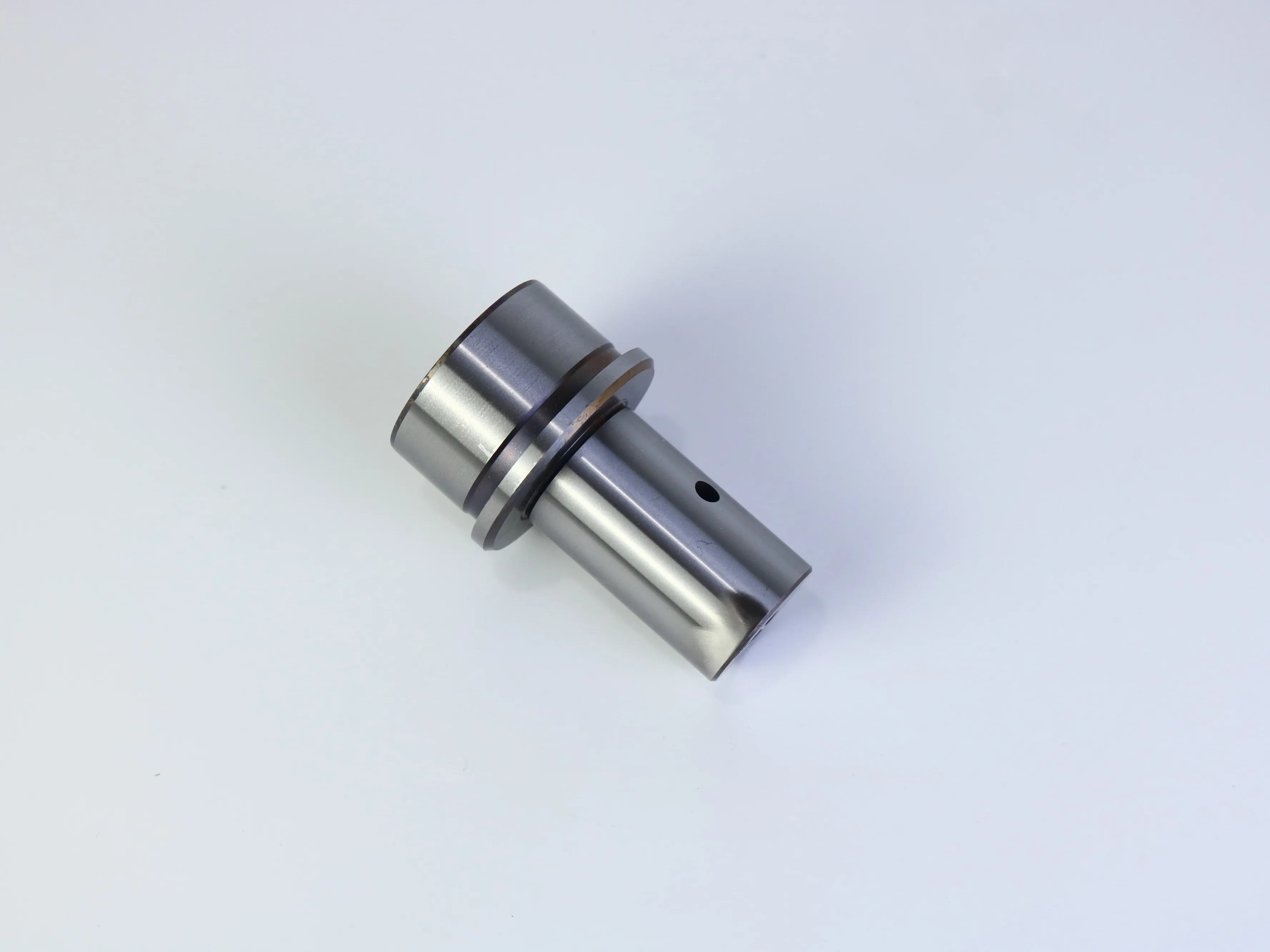 Precision CNC machined cylindrical component with stepped flange and shaft