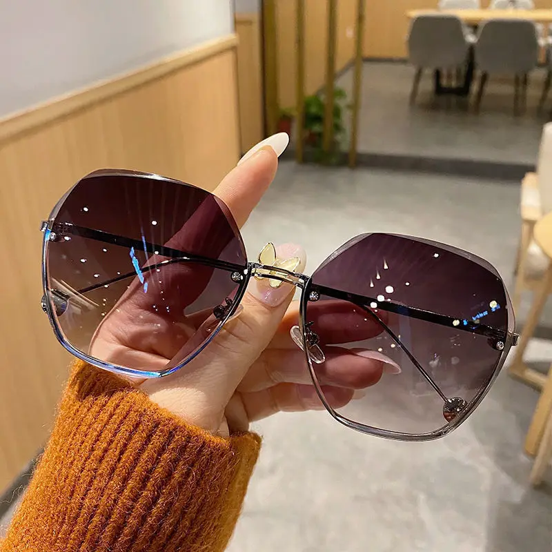 

2023 Summer Large Frame Rimless Sun Glasses Lunette De Soleil Female Shades Gradient Sunscreen Beach Sunglasses