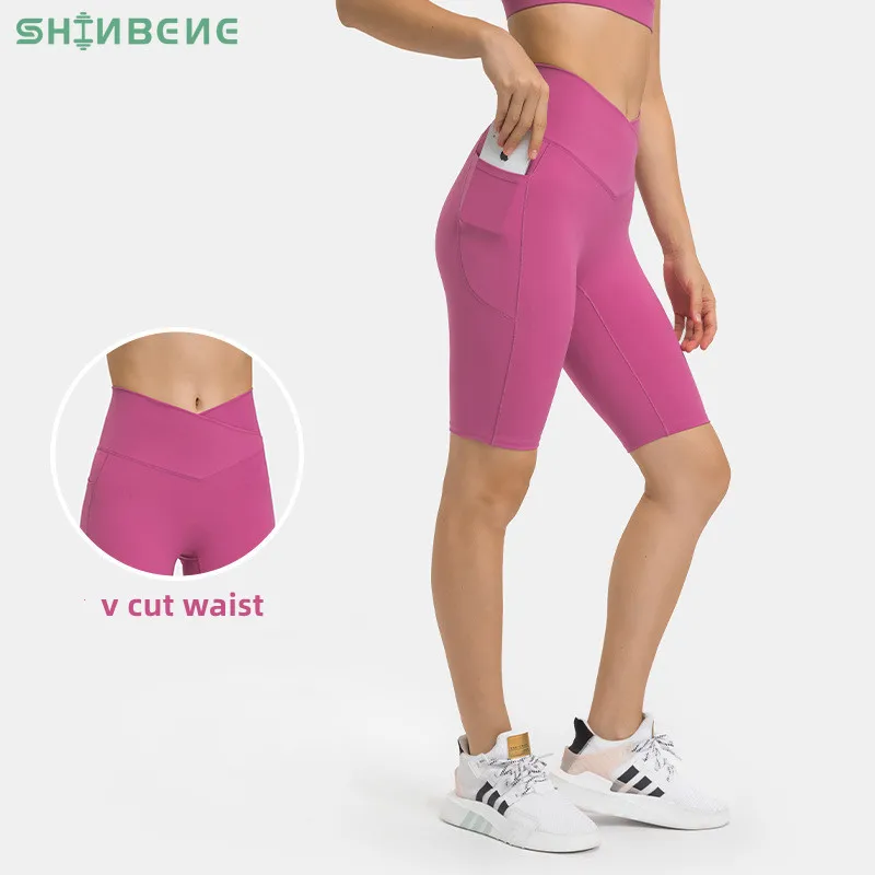 

SHINBENE Women's High Waist Plain Biker Shorts V Cut Crossover Waist Yoga Shorts with Side Pockets