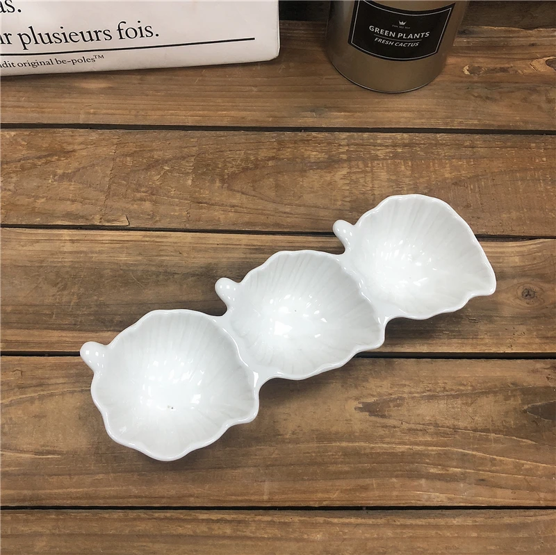 

White porcelain ceramic plates with leaf design for dessert and salad snack use