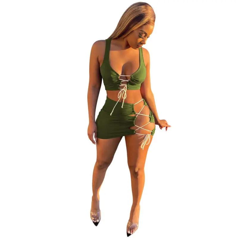 

2021 New arrival women Hollow Out top and bandage skirt two piece set women ladies clothing
