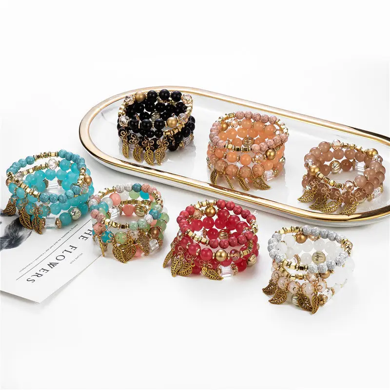 

Newest Design Yiwu High Quality acrylic cuff bracelets Golden Leaf Pendant glass beads Ladies bracelets Wholesale