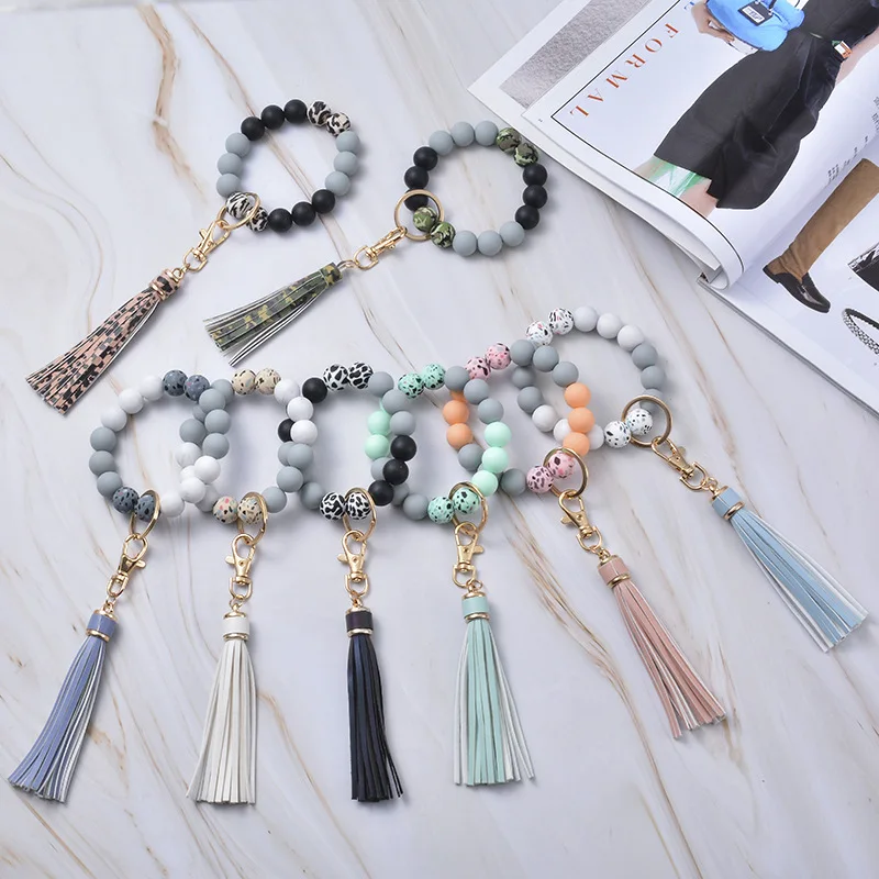 

Wholesale Newest Leopard Color Silicone Beads Bracelet 2021 Luxury Keyring Bracelet with PU Leather Tassel Fashion Bracelet