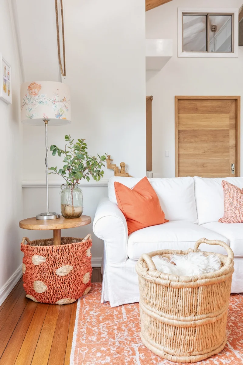 Washable orange throw pillows on a couch