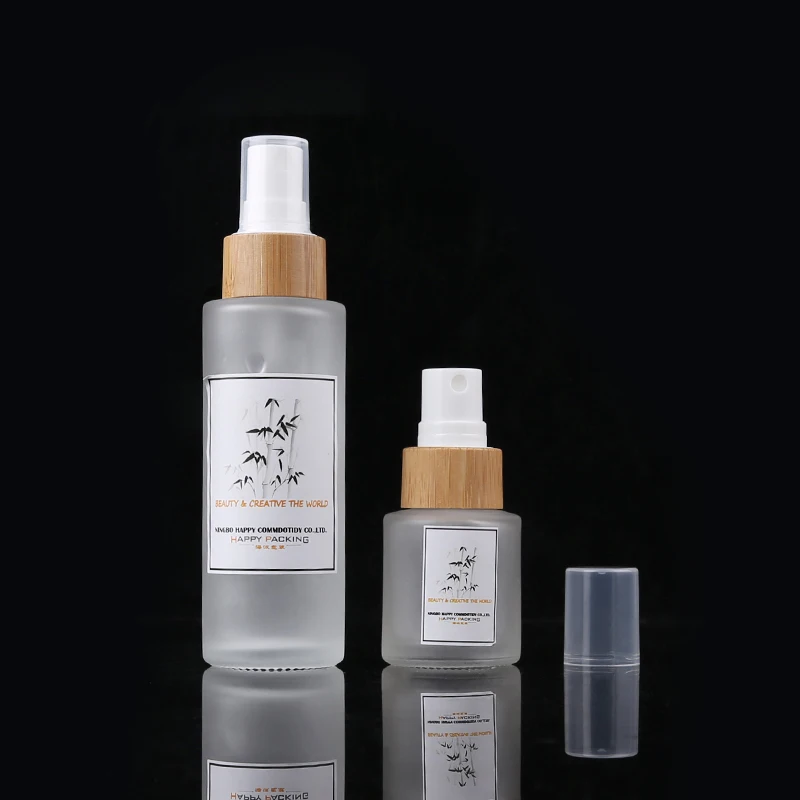 

Cosmetic Bamboo Bottles 30ml 50ml 100ml 120ml Frosted Clear Glass Spray Bottle With Bamboo Wood Lid Lotion Pump