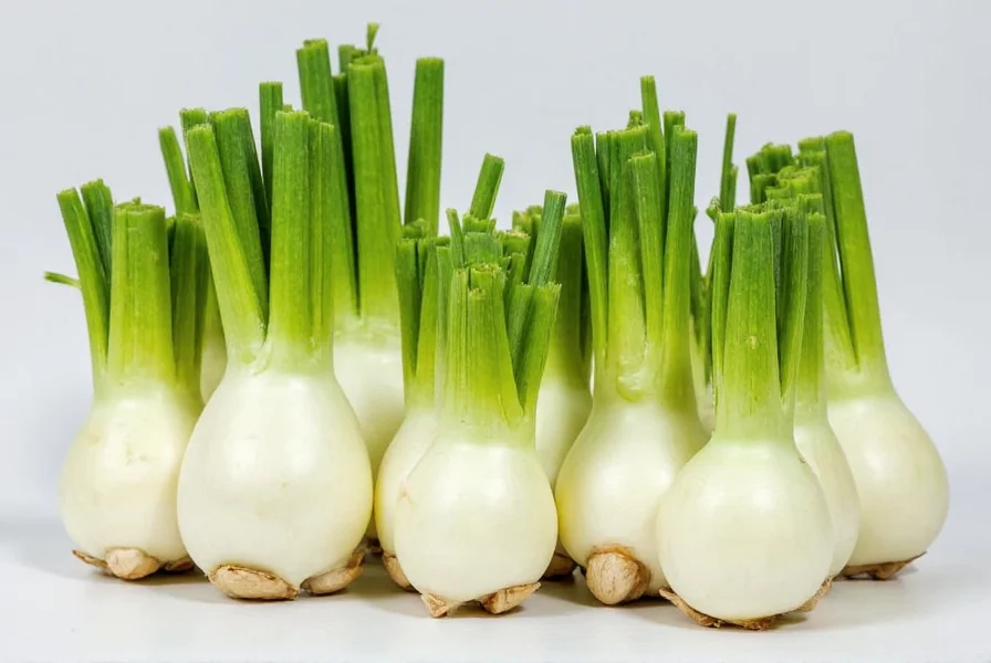 Roasted fennel bulbs with herbs and lemon slices on a baking sheet