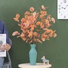 Long single eucalyptus table vase flower arrangement simulation leaf green plant placement