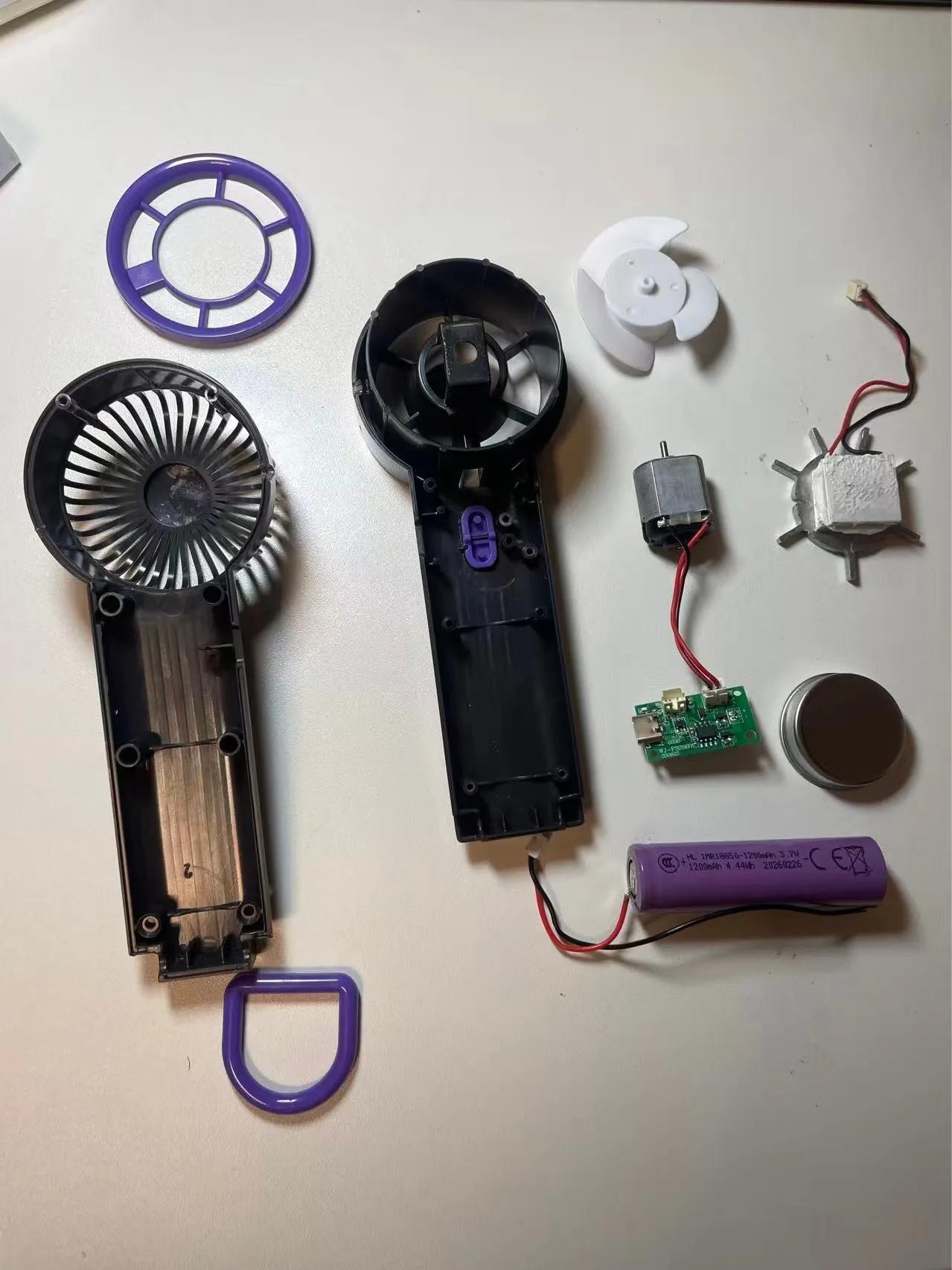 Teardown of a market handheld cooling fan — total BOM: $13.50