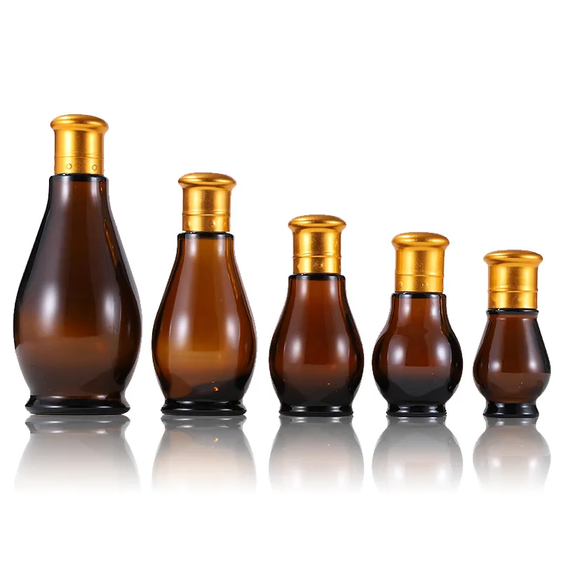 

Wholesale cosmetic glass bottle 50ml 100ml lotion bottle with gold lid gourd shape amber glass bottle