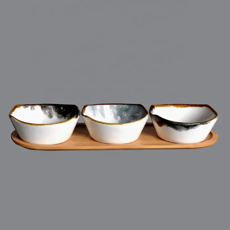 ceramic bowl with wooden tray