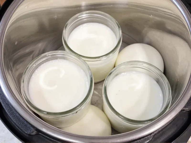 Glass jars filled with milk inside Instant Pot before fermentation