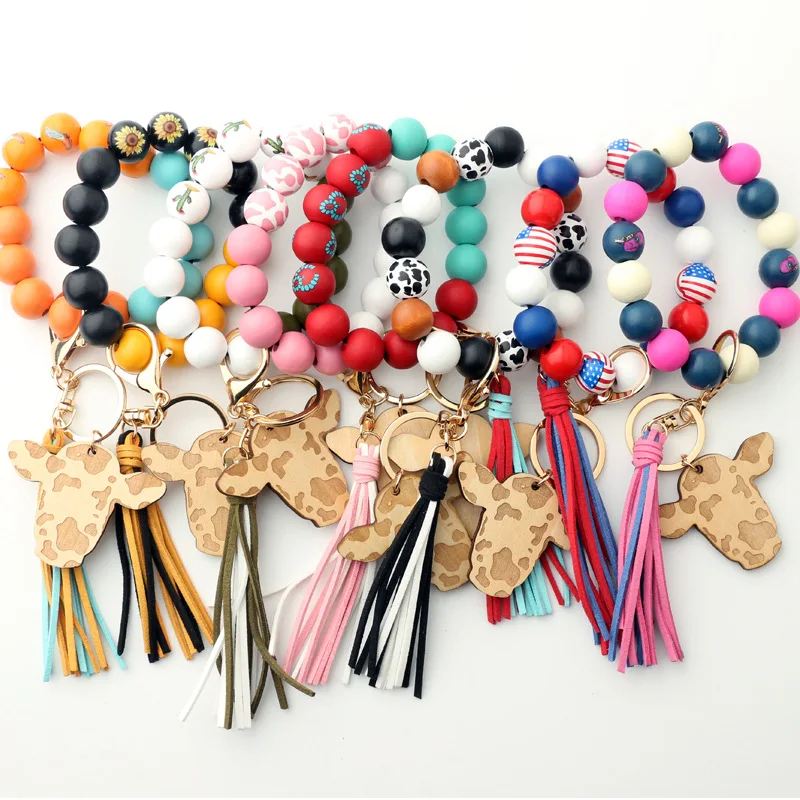 

Cowboy Series Wood Chip Cow Head Key Chain Colorful Wood Bead Bracelet Cow Pendant Tassel Keychain Bracelet