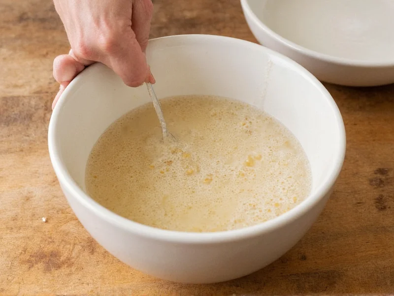 Masa harina and warm water mixing in bowl