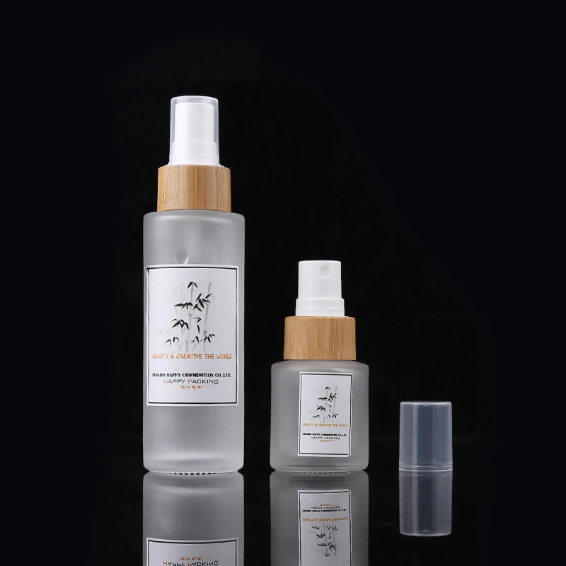 

Eco Friendly 20ml Empty Round Liquid Packaging Container Frosted Glass Packaging Spray Bottle With Bamboo Pump Sprayer