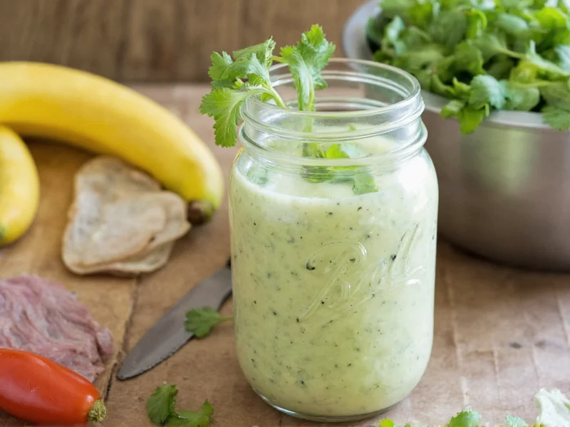 Homemade Caesar dressing in mason jar with fresh ingredients