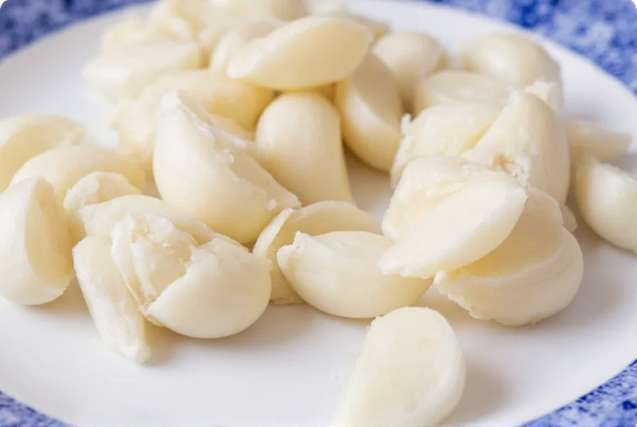 Different sizes of garlic cloves showing small medium and large varieties