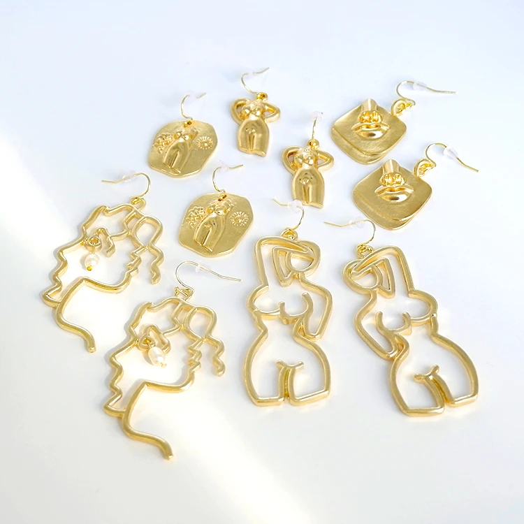 

Original freedom gold plated abstract art female hollow body shaped earrings, Picture