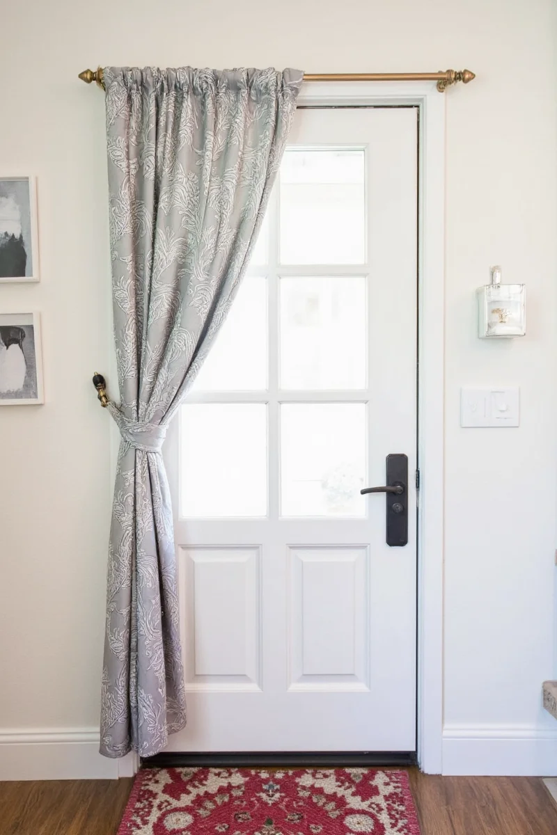 7 genius ways to style a curtain above door for family friendly spaces