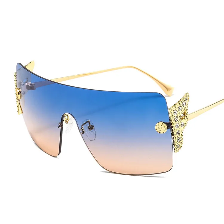 

2021 New Trend Women Luxury Sunglasses New Personality Winged Diamond Sun glasses Rimless One-piece Eyewear