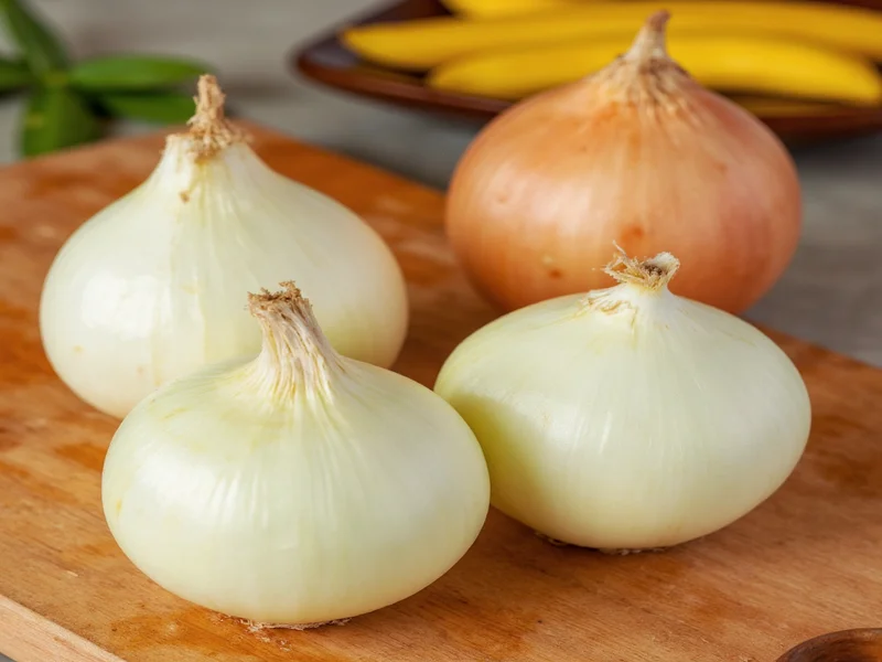 Fresh Vidalia onions on cutting board