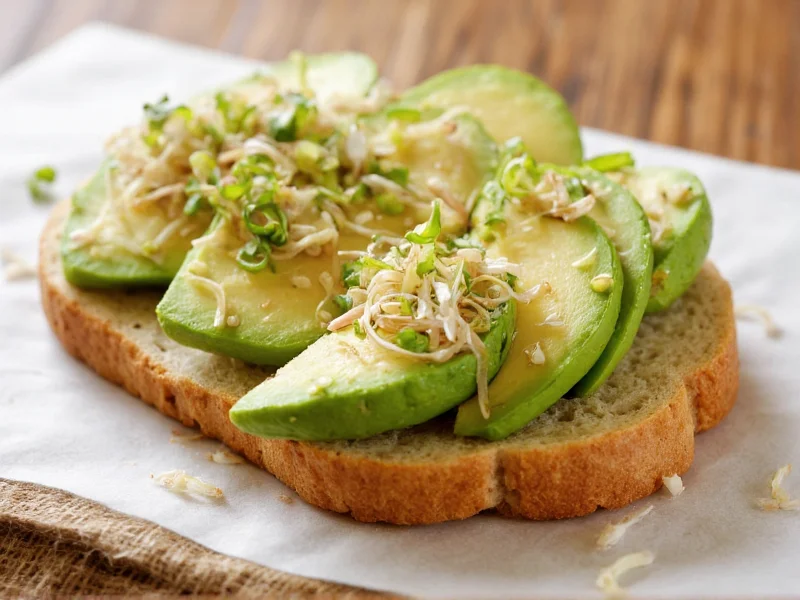 Sliced homemade sandwich bread with avocado and sprouts