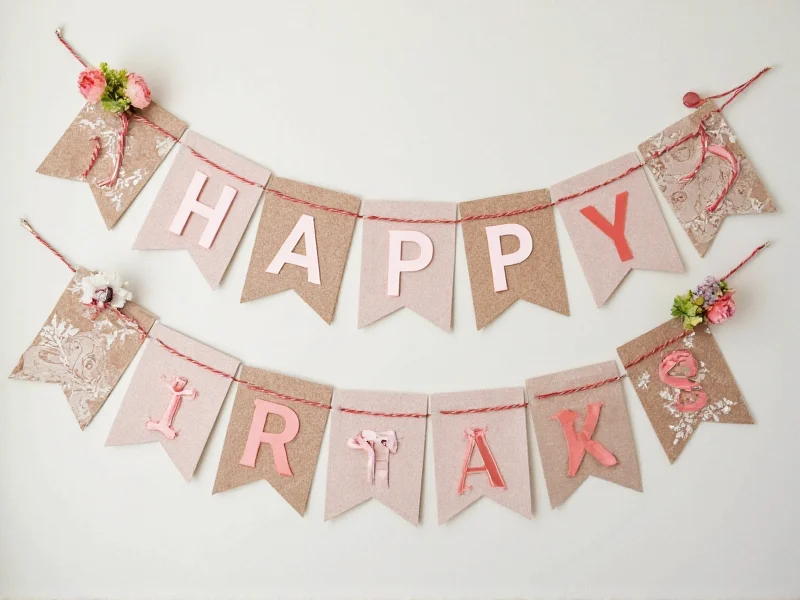 Finished birthday banner with dimensional letters and floral accents