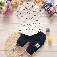 

Wholesale yiwu 2 year boys summer clothes baby boy clothing sets white Cool boy T-shirt button polo shirt