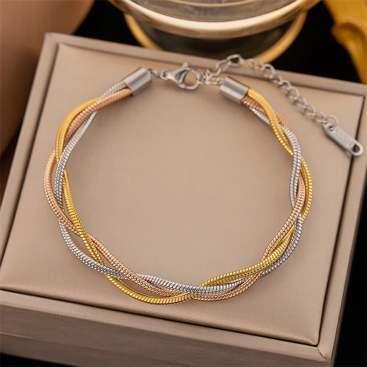 

Wholesale New Simple Fashion Jewelry Titanium Steel Snake Bone Chain Tricolor Woven Bracelet