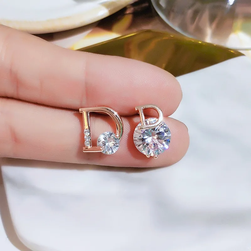 

Hot Sale Simple S925 Sterling Silver Needle Letter Diamonds Earrings Mismatched CZ Zircon Letter Initial D Stud Earrings