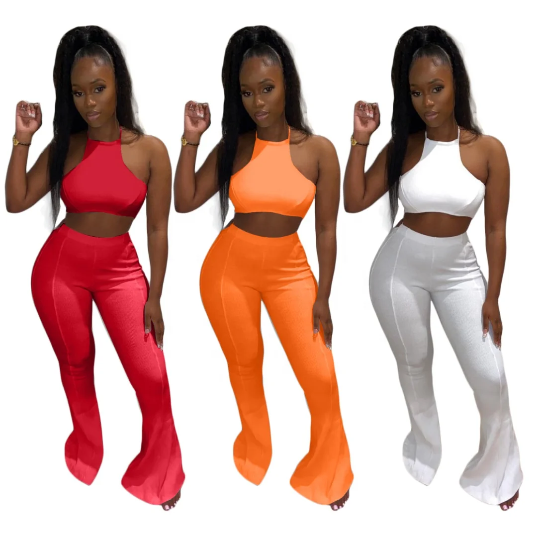 

MT146-047 Wholesale solid color fashion women's sexy lace-up hollow blouse with big flared trousers two-piece suit women sets