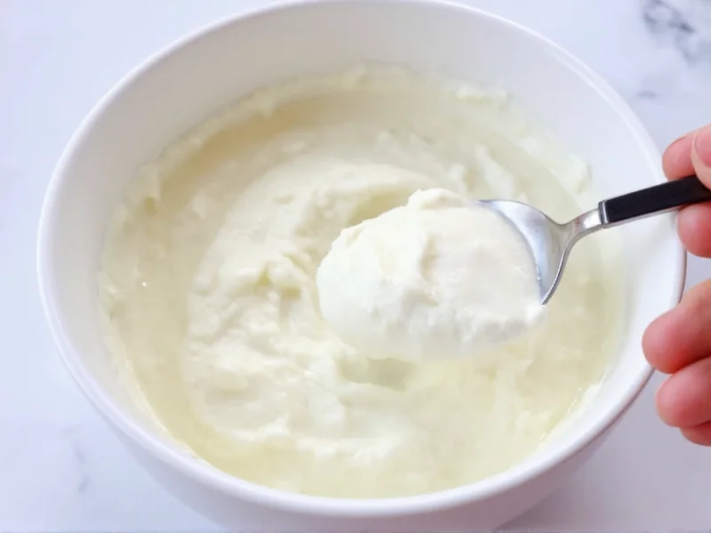Finished sour cream in bowl with spoon