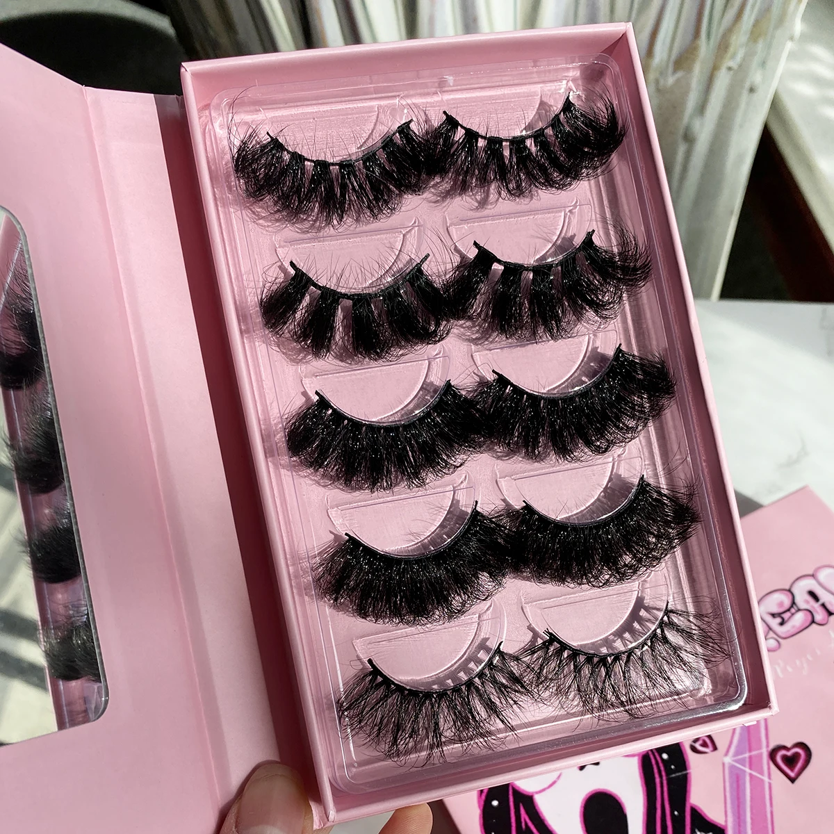 

Wholesale Fluffy 25mm Faux mink Lashes 3D Strip Faux mink Eye Lashes Vendors and Private Label vegan faux mink Eyelashes