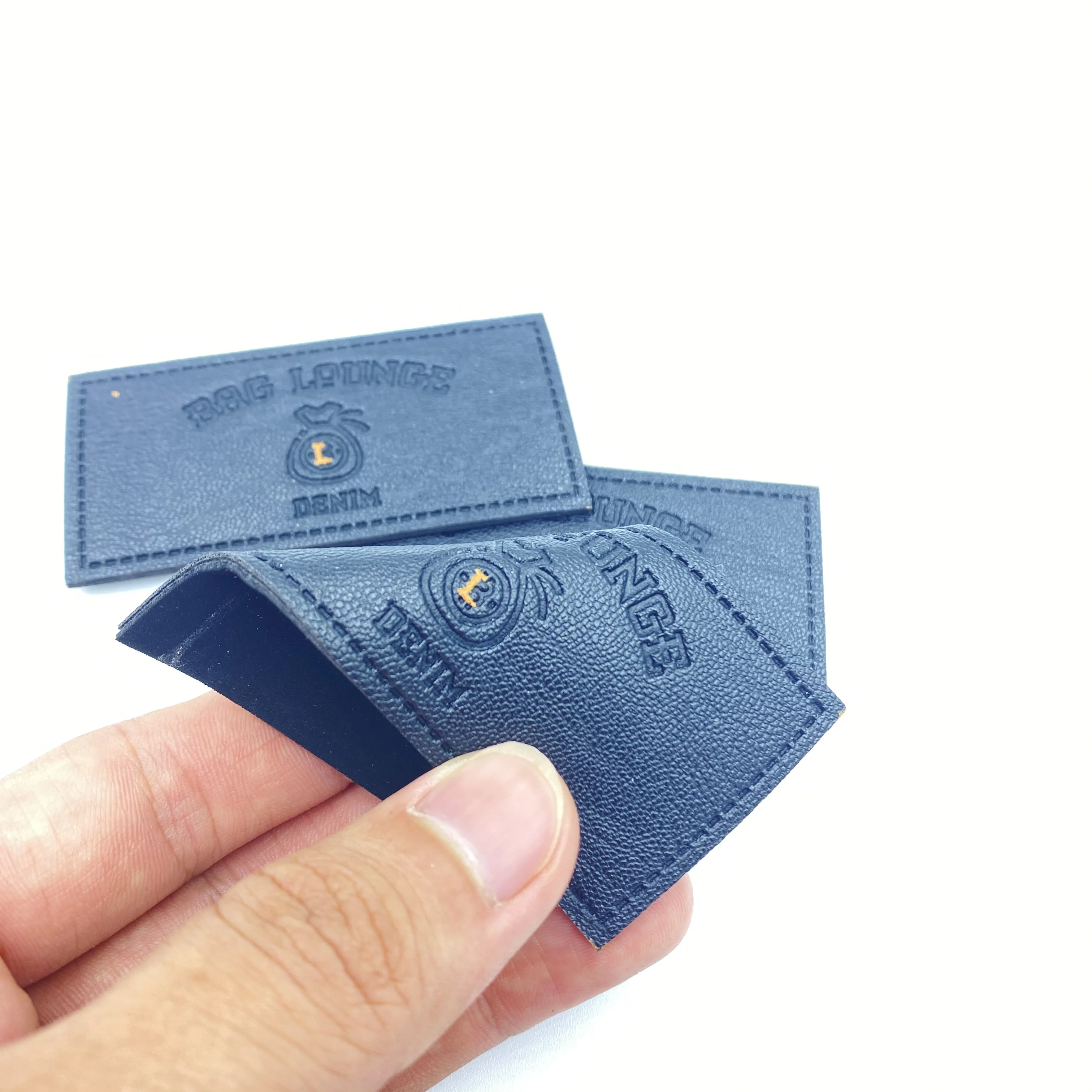 

Manufacturer custom luxury fashion new design brand logo embossed Pu artificial leather label and patch jeans and sofa, Custom color