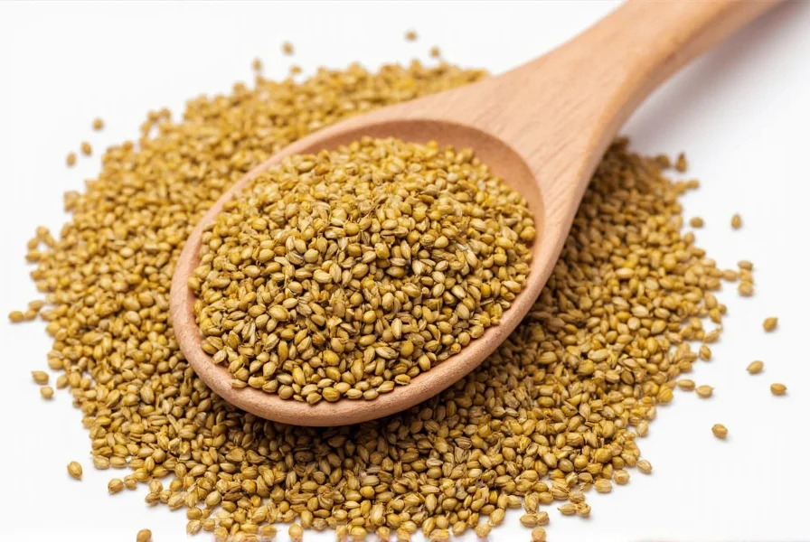 Close-up view of black, brown, and yellow mustard seeds arranged in separate piles on wooden background showing their visual differences