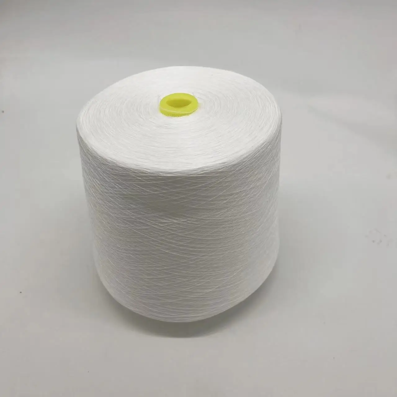 100% Polyester Staple Fiber 60S High Tenacity Dyed Bobbin Thread White Color Embroidery Sewing 602 85000m Per Cone