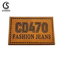 

Wholesale famous logo copy small leather brand logo patches for clothing jeans