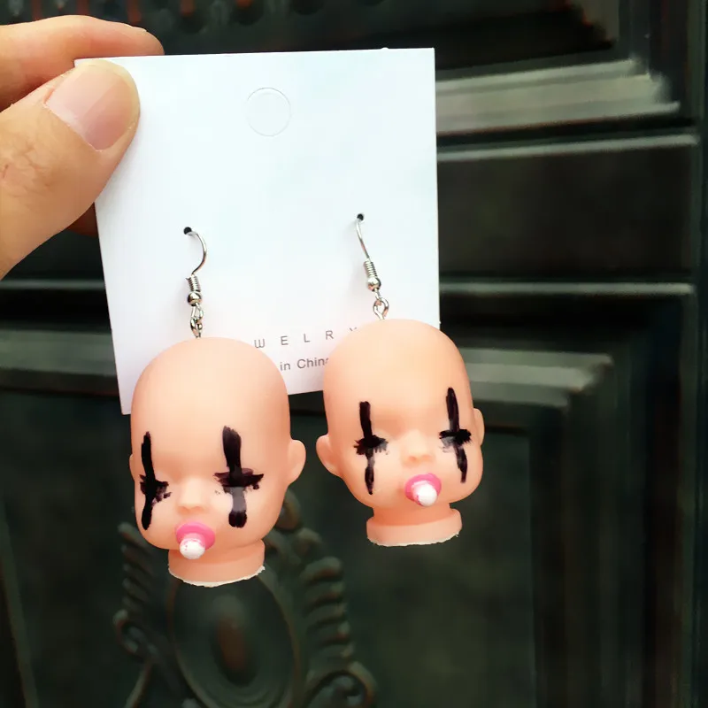 

New design Creative handmade funny cute doll head earrings niche exaggerated hip-hop baby sad bungee earrings