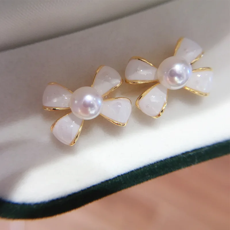 

Certified SOURCE Origin Zhuji Natural Fresh Water Pearl Earrings Female 18K Gilded Sweet Bow Stud Earrings Anti-Allergy