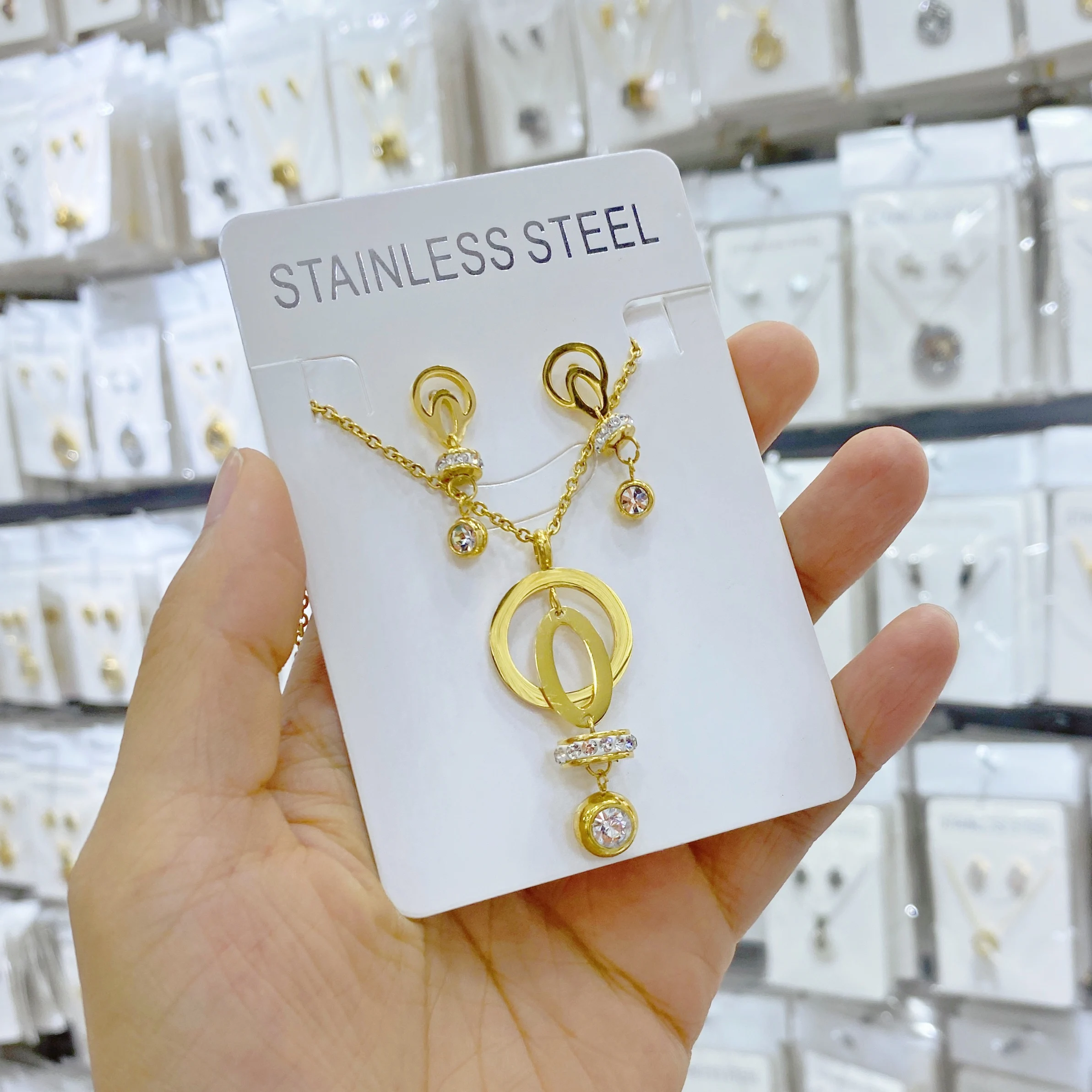 

Zircon pendant necklace with fashionable stainless steel jewelry set