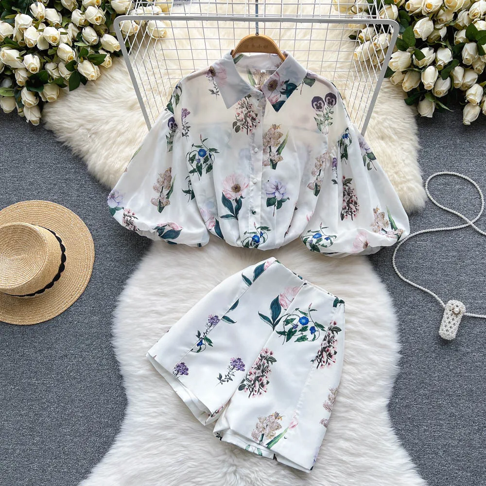 

Wholesale 2023 Summer Temperament Light Luxury Design Sense Lantern Sleeve Lapel Print Shirt Wide Leg Shorts Women's Set