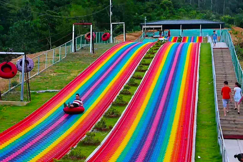 
Funny Outdoor Playground Amusement Games Children Grass Sliding Way Rainbow Dry Snow Slide For Sale 