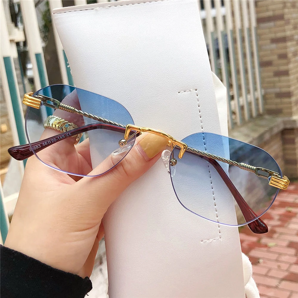 

Metal ladies rimless gradient lens fashion sun glasses for mans fashionable sunglasses women