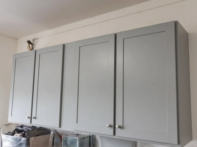 Finished garage cabinet with proper sealing showing no warping