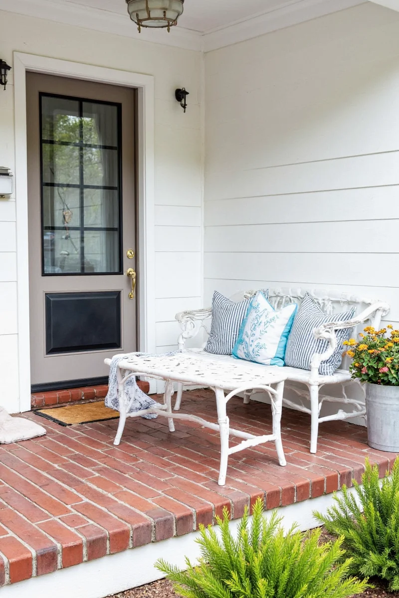 Front porch decorated for spring and autumn transitions