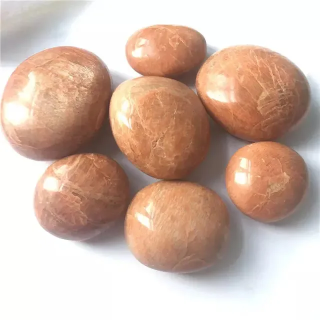 

Wholesale natural carved gemstone quartz peach moonstone palm crystal stones for home decor